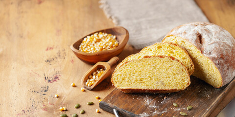 Fresh cornbread and corn grains on the table. Food grain crisis concept