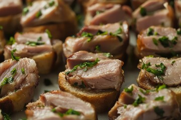 Montaditos de pernil, bite-sized finger food featuring savory pernil (slow-cooked pork) served on crusty bread, perfect for appetizers or snacks.