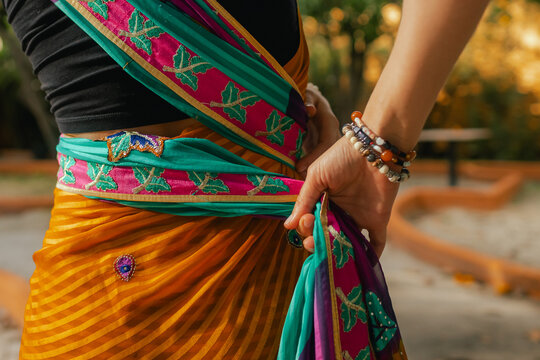 Close-up of Indian Traditional Beautiful young girl in saree posing outdoors. Happy Diwali greeting photo. Part of a series
