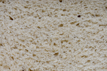 Slice of white bread. Slice of white bread close-up. Texture or background.