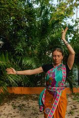 Indian Traditional Beautiful young girl in saree posing outdoors. Happy Diwali greeting photo. Part...