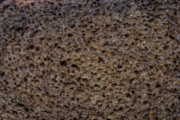 Piece of black bread. Piece of black bread close-up. Texture or background.