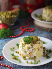 Olivier salad, traditional Russian dish, served on the plate