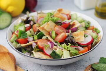 A bowl with Fattoush - Traditional Levantine salad