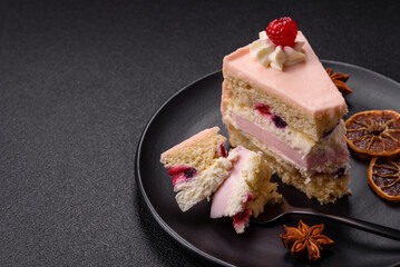 Piece of sweet cake with pink cream with raspberry flavor, with shortbread, cheesecake
