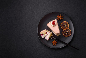 Piece of sweet cake with pink cream with raspberry flavor, with shortbread, cheesecake