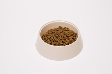 A Pet Food Bowl Filled with Kibble to Provide Nutrition for Your Beloved Animals at Mealtime