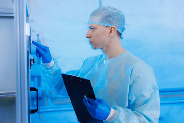 Concept industry medicine factory. Worker control production line automatic machine for manufacture...