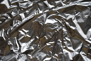 Food foil backgroundCrumpled silver foil as background, top view