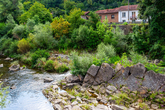 Vidima River rocky bed view in August vegetation in the Bulgarian Fore-Balkan village of Debnevo, Troyan Municipality