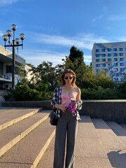 woman with coffee in the park