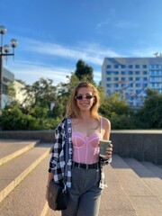 woman with coffee in the park