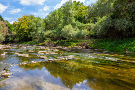 Sunny August view of the shallow waters of Vidima River in the Bulgarian Fore-Balkan village of Debnevo, Troyan Municipality