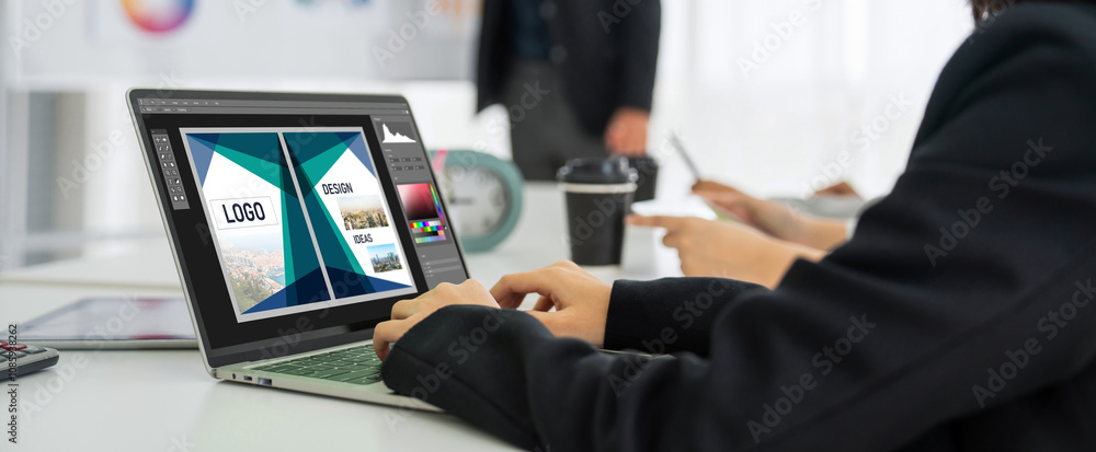 Poster graphic designer software for modern design of web page and commercial ads showing on the computer s