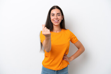 Young caucasian woman isolated on white background making money gesture