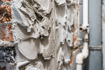 Repair and construction, wall in plaster and cement, laying tiles.