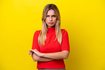 Young Uruguayan woman isolated on yellow background feeling upset