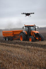 drone and tractor working together for sustainable agriculture, data-driven smart farming