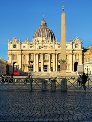 Rome, Italy - November 17, 2024: View of St. Peter's Basilica and the Vatican Obelisk in St....