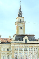 Fototapeta premium A panoramic city view of Novi Sad with its iconic bridge over the Danube River is a breathtaking sight. From this vantage point, the city sprawls beneath the sky, with the elegant Varadin Bridge