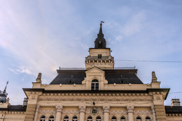 Fototapeta premium A panoramic city view of Novi Sad with its iconic bridge over the Danube River is a breathtaking sight. From this vantage point, the city sprawls beneath the sky, with the elegant Varadin Bridge