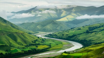 Winding River Valley: A picturesque landscape featuring a meandering river carving its way through a lush valley, framed by rolling hills, under a sky kissed by clouds.
