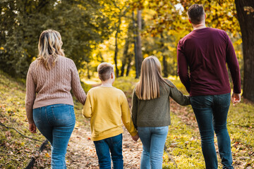 Family Walking In Park