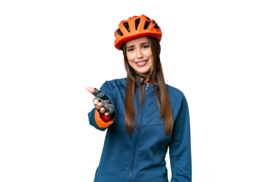 Young cyclist woman over isolated chroma key background shaking hands for closing a good deal