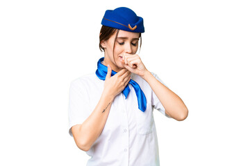 Airplane stewardess over isolated chroma key background is suffering with cough and feeling bad