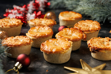 Christmas steak mini pie with decoration, gifts, green tree branch