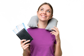 Young beautiful blonde woman with Inflatable travel Pillow over isolated background thinking an idea while looking up