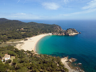 Aerial cityscape view of beach and Mediterranean Sea along Costa Brava in Palamos Catalonia