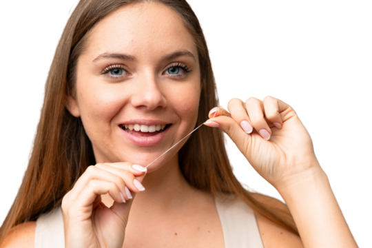 Young blonde woman over isolated chroma key background using dental floss with happy expression. Close up portrait