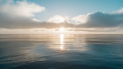Obraz premium Tranquil Waters at Dawn: The sun ascends over the sea, a sight of peace, and the waters reflect the soft glow of the clouds above