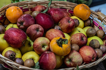 Colorful variety of fresh fruits in a wicker basket, vibrant and ripe