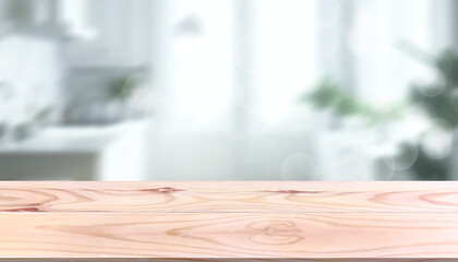 Empty wooden table front white kitchen background with blurred light from window sparkling bokeh modern minimalist style. Texture pattern for displaying food or showcasing home decoration products.