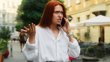 Angry displeased frustrated woman mad annoyed lady female businesswoman girl tourist in city talk...