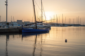 Sunset in the port with its fishing boats