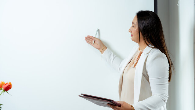 Business professional giving a presentation during a meeting