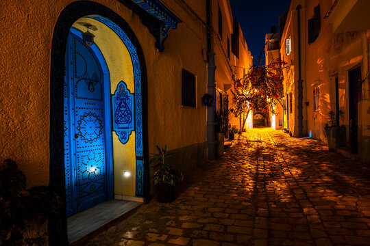 Narrow street of the medina of Bizerte at night, Tunisia.