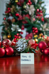 Christmas centerpiece decoration with a handwritten note that says 