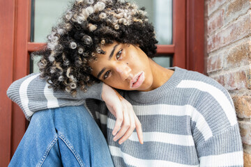 Relaxed university student with unique style and identity