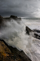 Waves crashing along Oregon Coast at Cape Kiwanda State Natural Area.