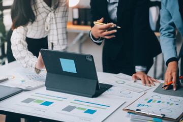 Fund managers team consultation and discuss about analysis Investment stock market at office