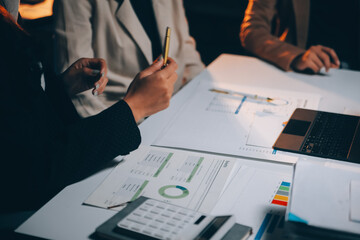 Fund managers team consultation and discuss about analysis Investment stock market at office