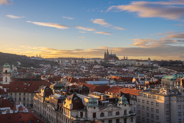 Obraz premium The view from the Old Town Hall over the roofs to Prague Castle in the evening sun