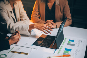 Fund managers team consultation and discuss about analysis Investment stock market at office