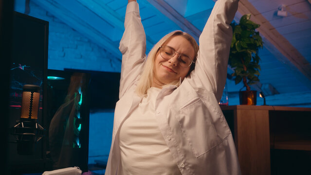 Late night online work deadline tired female girl business woman businesswoman worker coder hacker developer typing computer crypto trading web e-commerce at home overtime stretching hands overwork