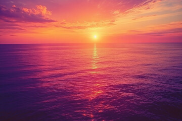Obraz premium A breathtaking sunset over a vast ocean, with hues of orange, pink, and purple