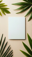 Blank canvas surrounded by green palm leaves creating a serene artistic atmosphere